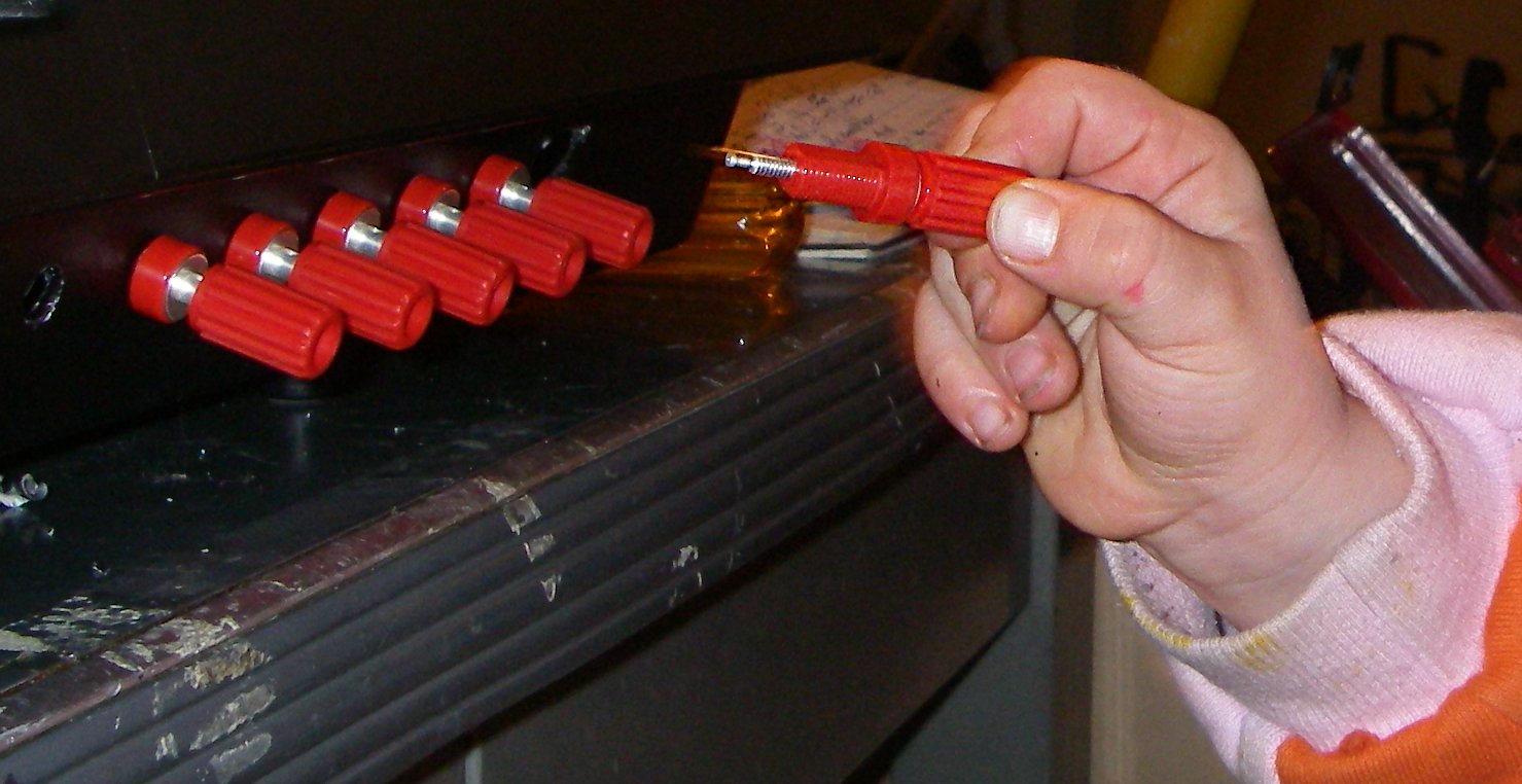 tightening the banana connectors with a nut driver